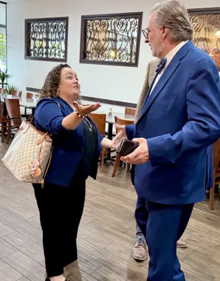 Chevonne Lorigo-Johst gestures while speaking with Dr. Russell Lowery-Hart.