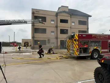 Pflugerville firefighters participating in a live-fire training exercise