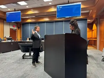 Jonathan Coffman taking the oath of office for Pflugerville City Council Place 1