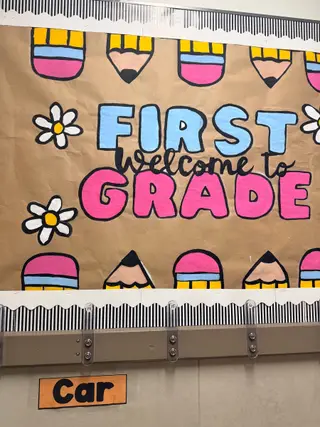 A colorful bulletin board at Timmerman Elementary reading “Welcome to First Grade”