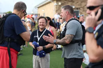Jonathan Coffman talking with Pflugerville Fire Department participants before the September 11 memorial stair climb