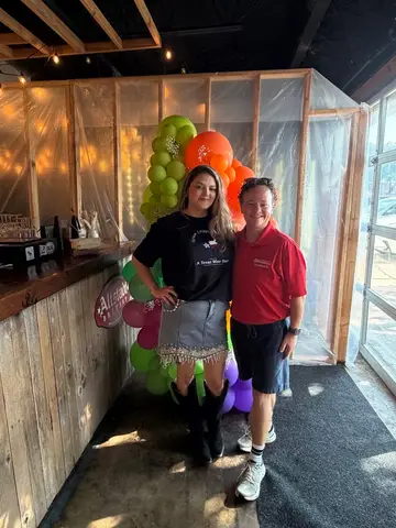 Jonathan Coffman with a Pflugerville local business owner