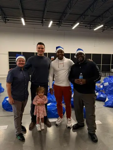 Jonathan Coffman with Blue Santa volunteers and public safety partners