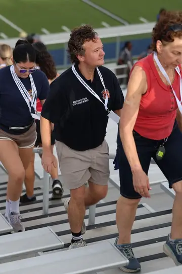 Jonathan Coffman and residents climbing stadium stairs during the September 11 memorial event