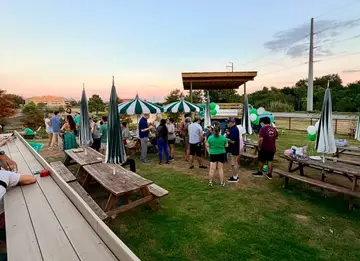 Pflugerville residents gathered outdoors at Old Gregg for the Goodbye Flock party