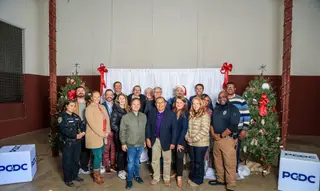 A large Pflugerville community group gathered for a holiday recognition photo