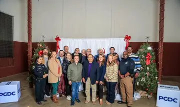 A large Pflugerville community group gathered for a holiday recognition photo