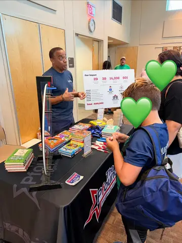 Families learning about Pflugerville Education Foundation resources at the CommUNITY Fair
