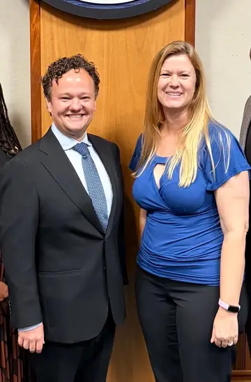 Jonathan Coffman with a Pflugerville council member after the swearing-in meeting