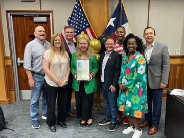 Jonathan Coffman with Pflugerville council colleagues at a community recognition
