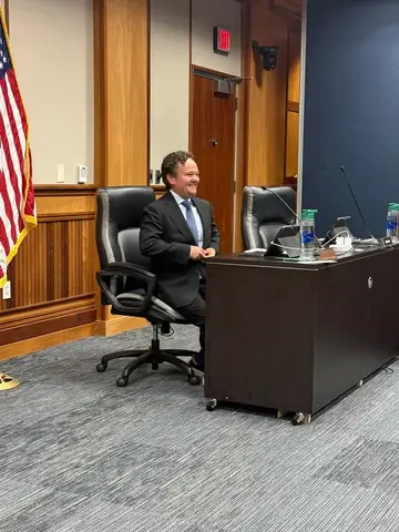Jonathan Coffman seated at the Pflugerville City Council dais