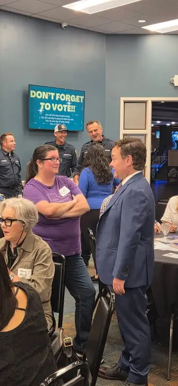 Jonathan Coffman speaking with business owners at a Pflugerville event