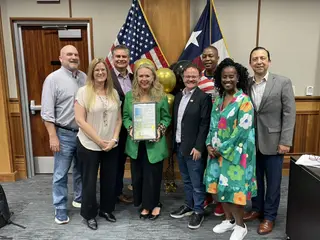 Jonathan Coffman with Pflugerville council colleagues at a community recognition