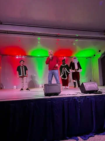 Community leaders on stage at a Pflugerville holiday event