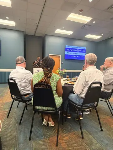 Pflugerville Chamber members listening to Jerry Jones Jr.'s mid-year economic development update