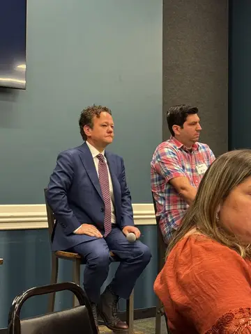Panelists and attendees at a Pflugerville business event