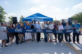 Jonathan Coffman and community leaders at the ribbon cutting for the Helios Way extension