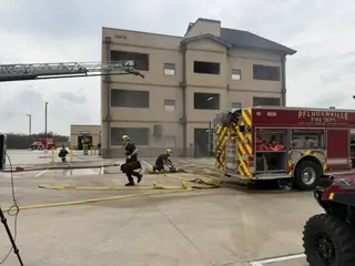 Pflugerville firefighters participating in a live-fire training exercise