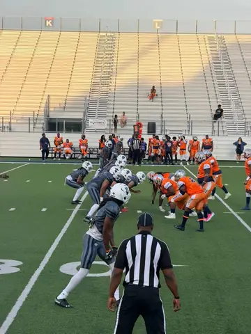 Youth football players lined up at a Pflugerville game